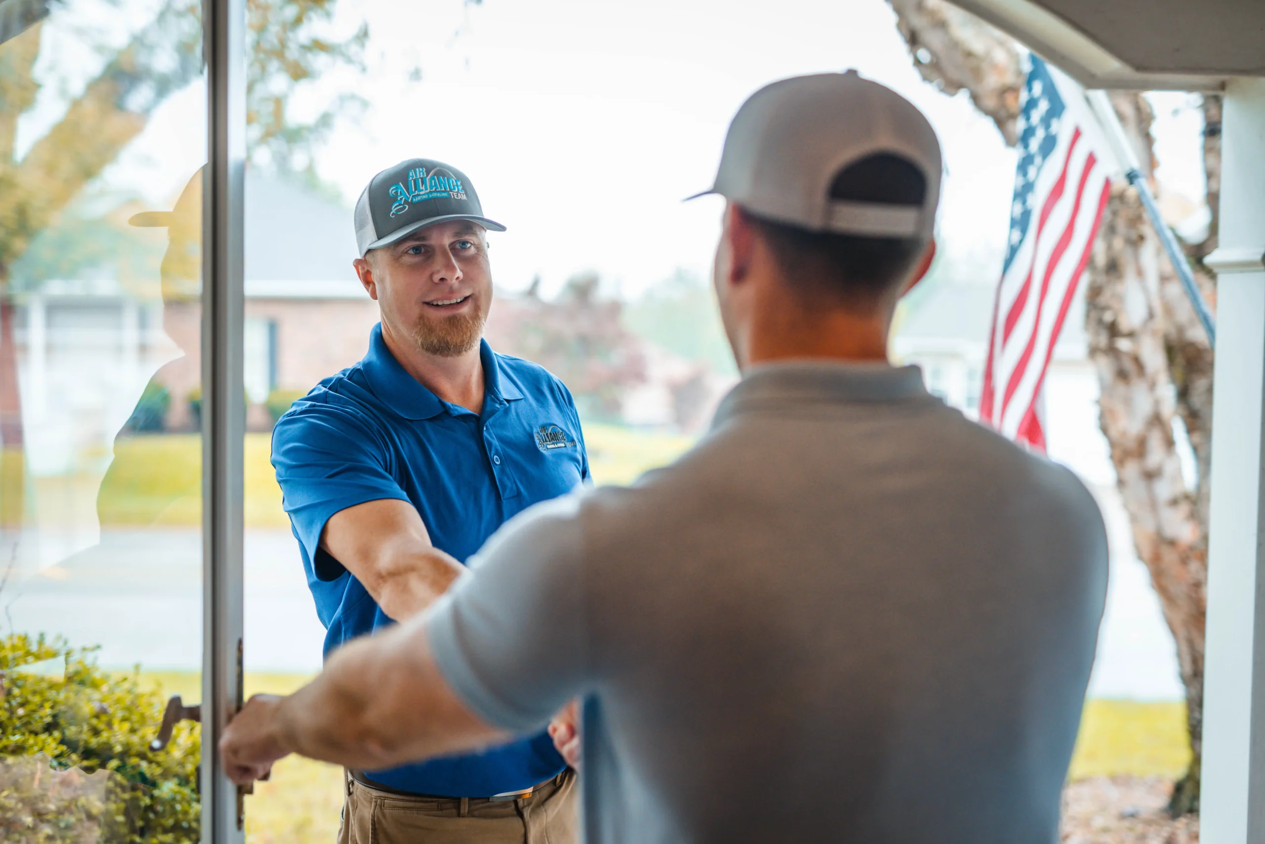 HVAC contractor in Cottleville MO greeting homeowner before service visit