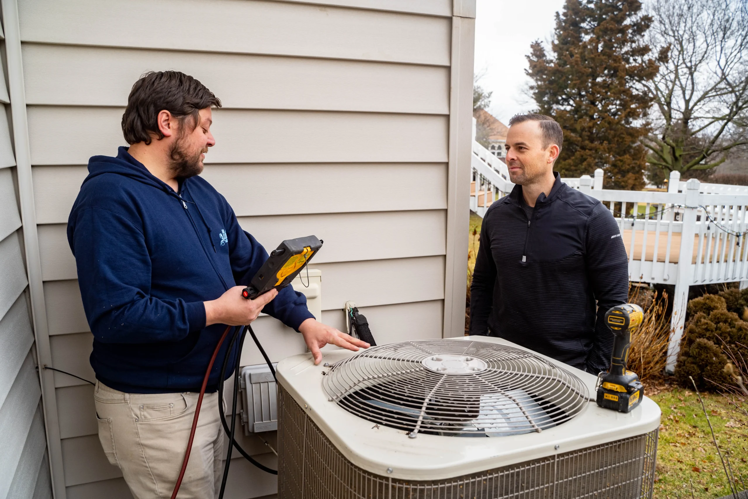 Air Alliance Team technician servicing outdoor air conditioning unit for Missouri homeowner
