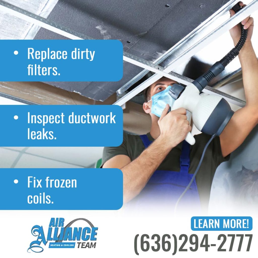 HVAC professional using specialized tools to clean air filters and inspect ductwork for leaks.